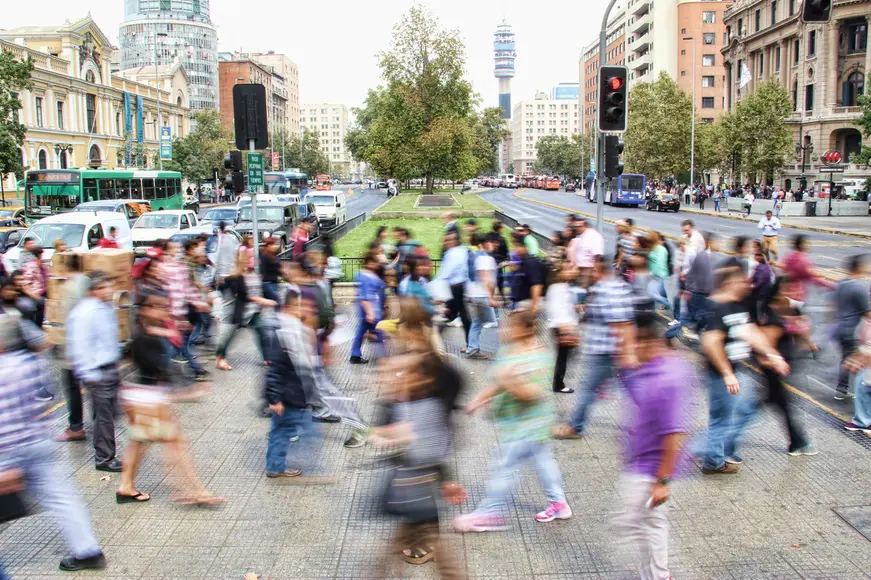 Blurred photo of many people in a community quickly crossing the street free from worrying about justice in society.